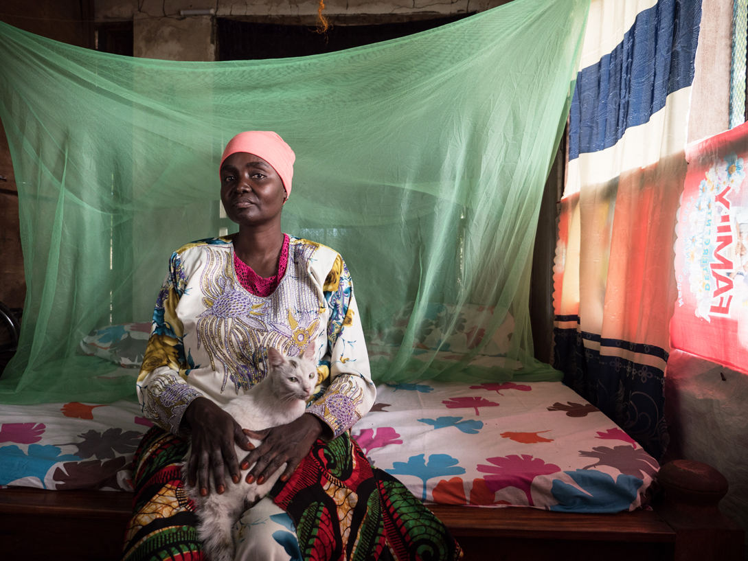 Halima Ramadhan, 45, cleaning woman. "Whitey [the cat] was still very small when my friend brought her over. I brought her up on porridge. She trusts us because of that. When we call her, she comes. My children are always playing with her and at night Whitey sleeps with them in their bed. Pets aren’t common here. People only keep animals to use them, like dairy cows or watchdogs, even though dogs are considered haram. Children throw stones at them and the kids in the neighbourhood also pester Whitey. My children are different. When Whitey gets hurt fighting stray cats, they take care of her wounds."