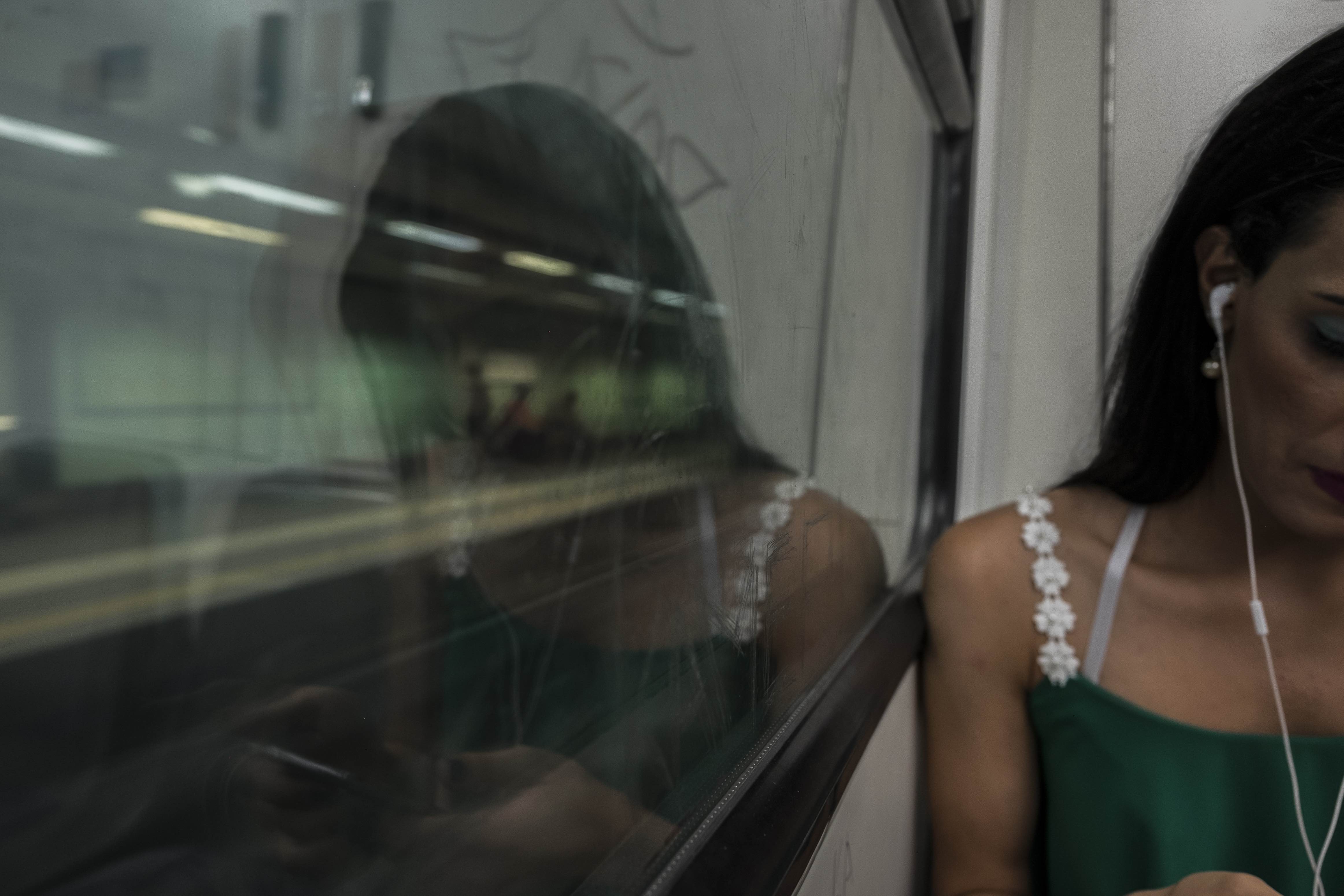 A., 24, a trans woman from the Middle East (who asked not to have her nationality revealed for security reasons), rides the metro on her way to meet some friends at a bar in Athens, Greece. August 6, 2017