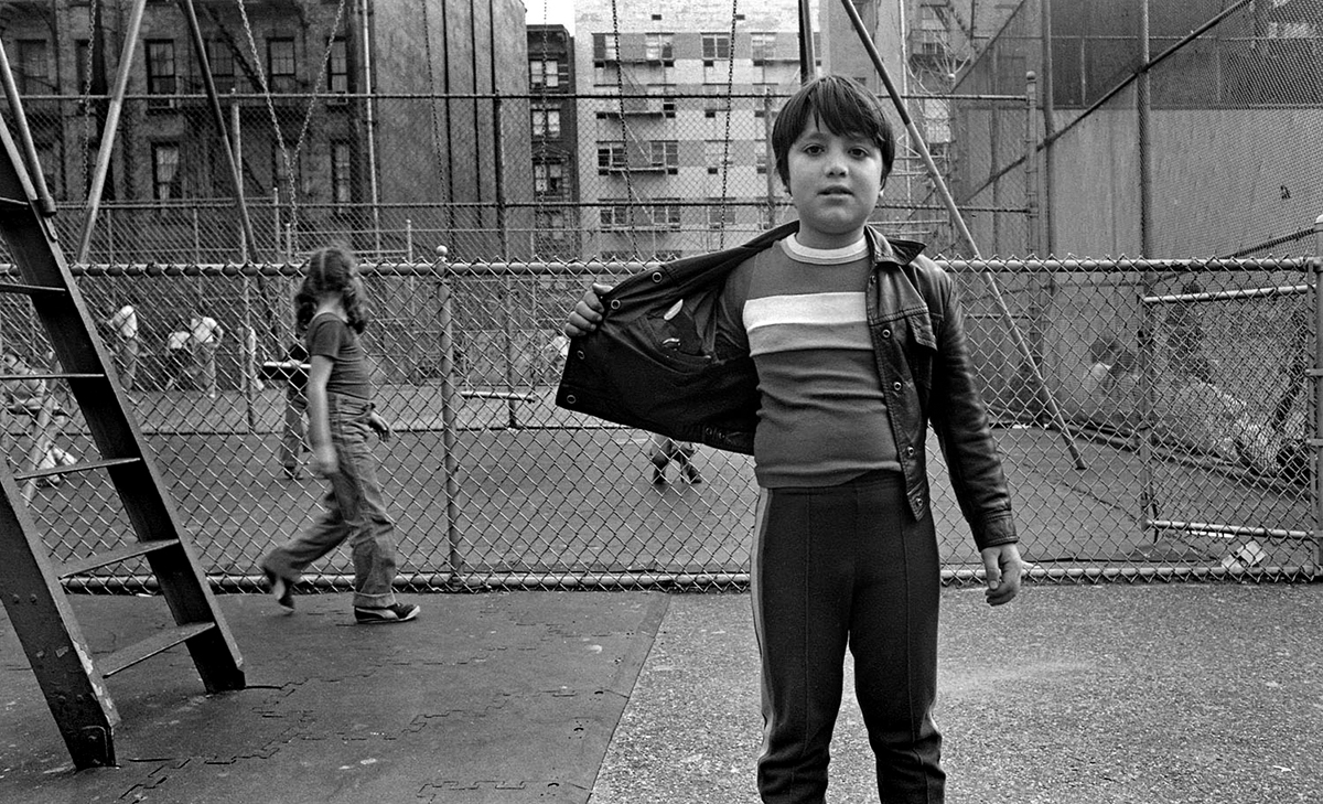 Boy with gun in playground