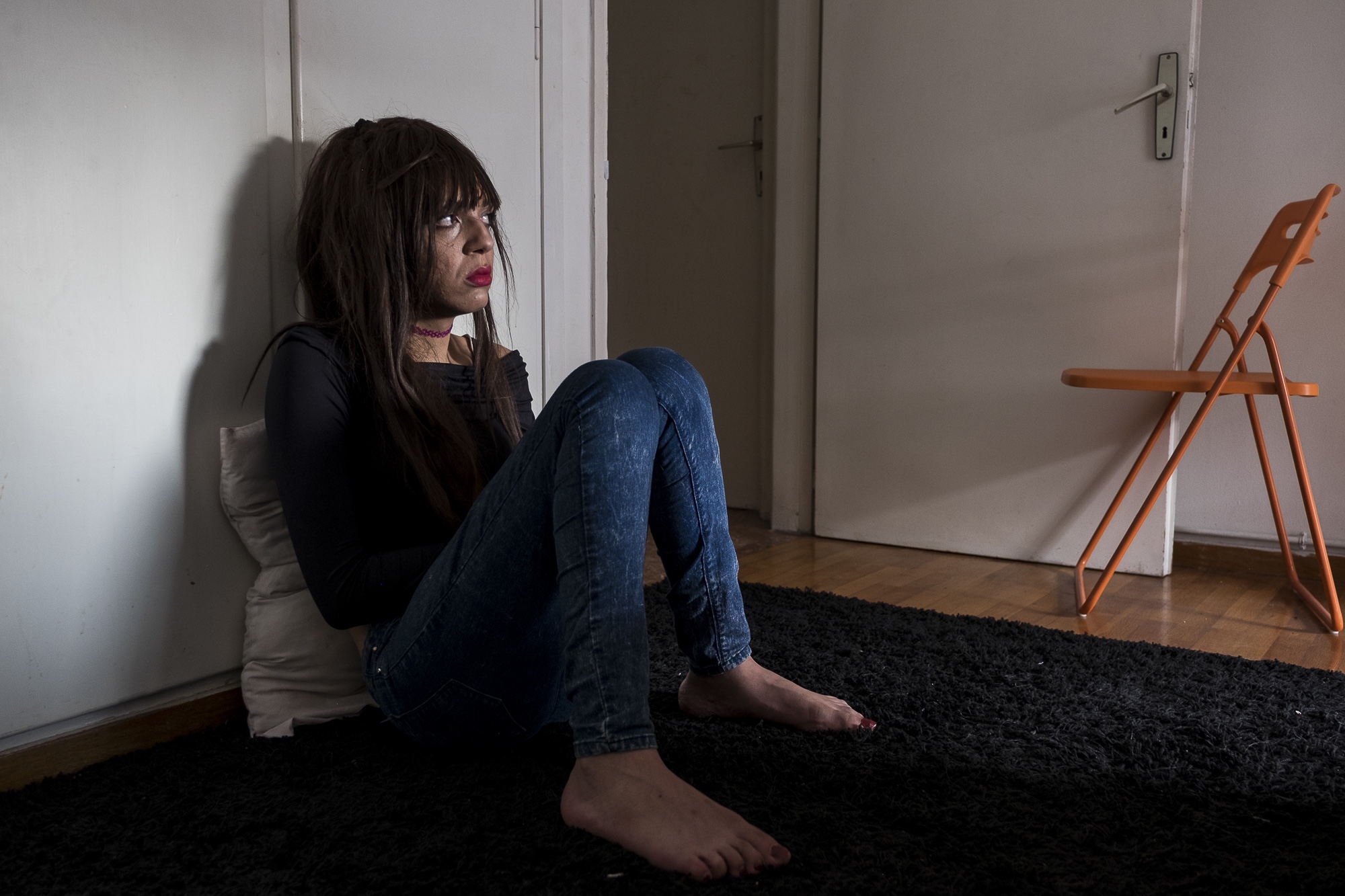 Y., 28, a transgender woman from Morocco relaxes with friends at their apartment in Athens, Greece. September 1, 2017